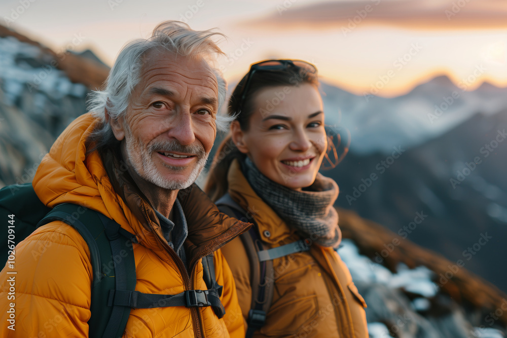 Senior Caucasian couple traveling together in nature, mountain climbing