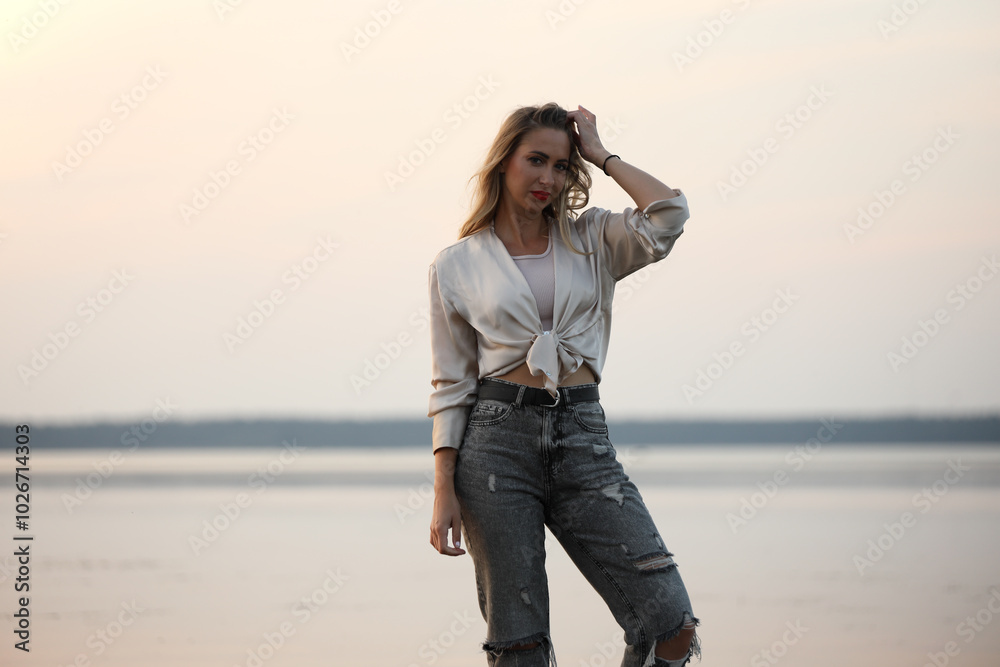 young woman posing near the sea young woman posing near the sea