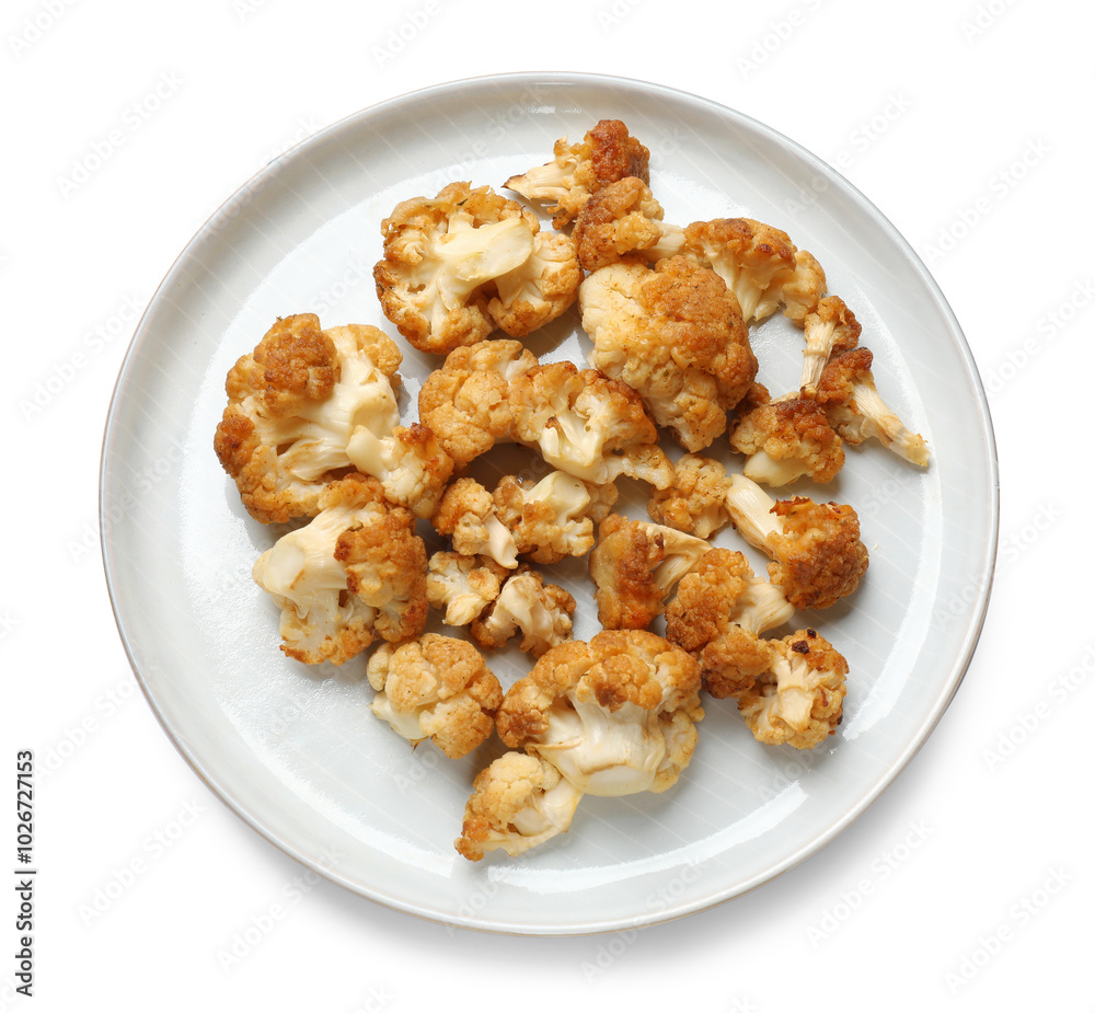 Plate with baked cauliflower on white background, top view