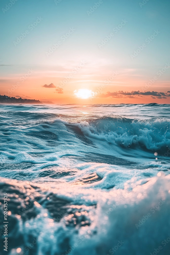 Naklejka premium Sunrise over ocean with gentle waves, creating a serene atmosphere in morning light