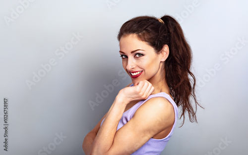 Happy smiling good energetic woman with long hairstile looking in fashion purple blouse. Closeup studio portrait