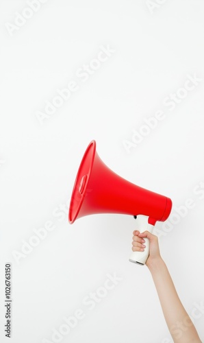 Hand holding a red megaphone on white background