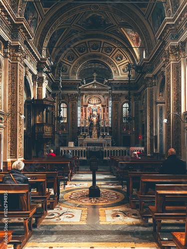 Εκτύπωση καμβά The ornate interior of the Church of Santa Maria Maddalena in Monza, Italy, featuring intricate gold detailing, arched ceilings, and an illuminated altar