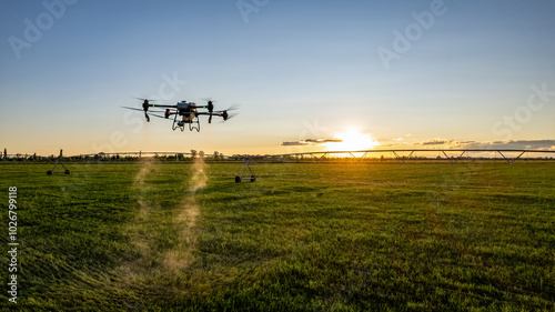 Agro drone works on the field. Field treatment with chemicals. Spraying pesticides against pests. Innovations in the agricultural sector.
