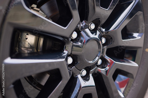 Wallpaper Mural Detailed shot of a sleek black and silver alloy wheel on a motor vehicle Torontodigital.ca