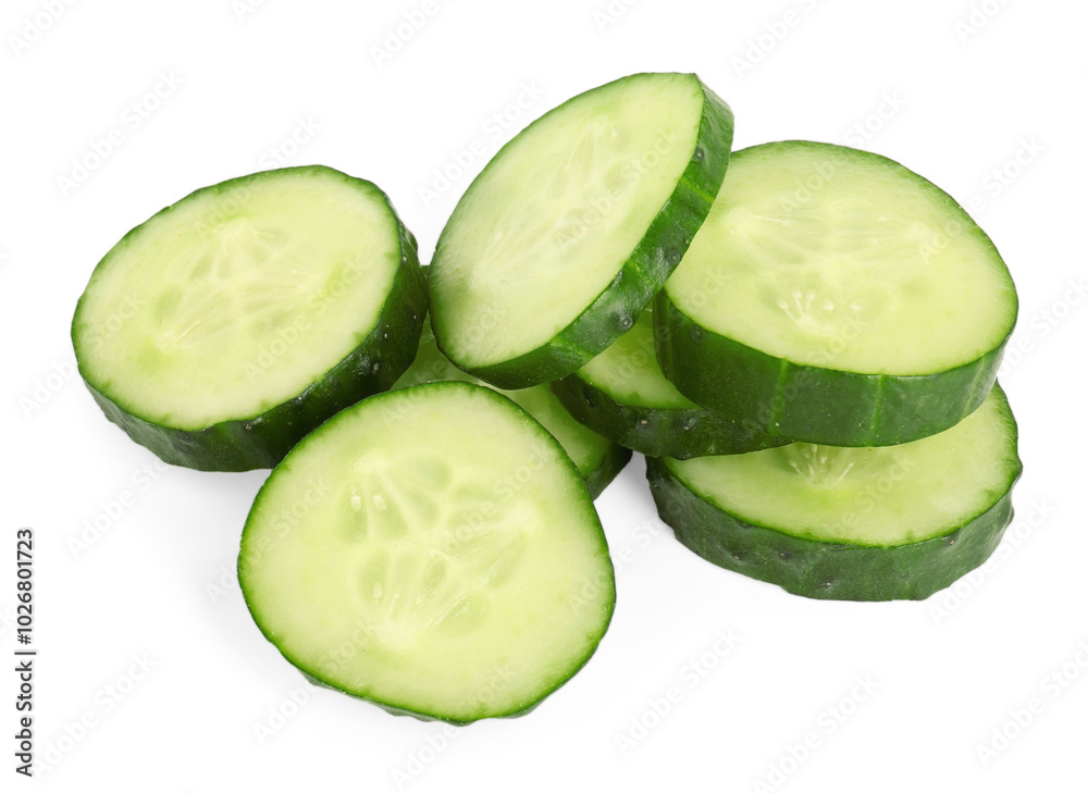 Pile of fresh cut cucumber slices isolated on white Pile of fresh cut cucumber slices isolated on white
