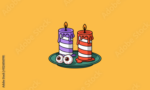 Two striped candles with eyeballs on a plate, Halloween-themed.