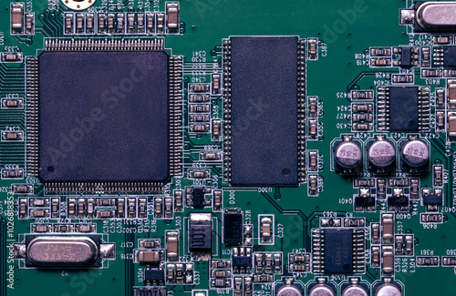 Electronic circuit board close up, green computer printed circuit board, top view