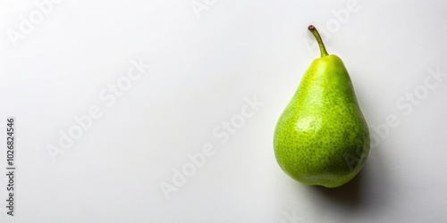 A solitary green pear with a smooth skin and a delicate stem sits on a white background, casting a subtle shadow.