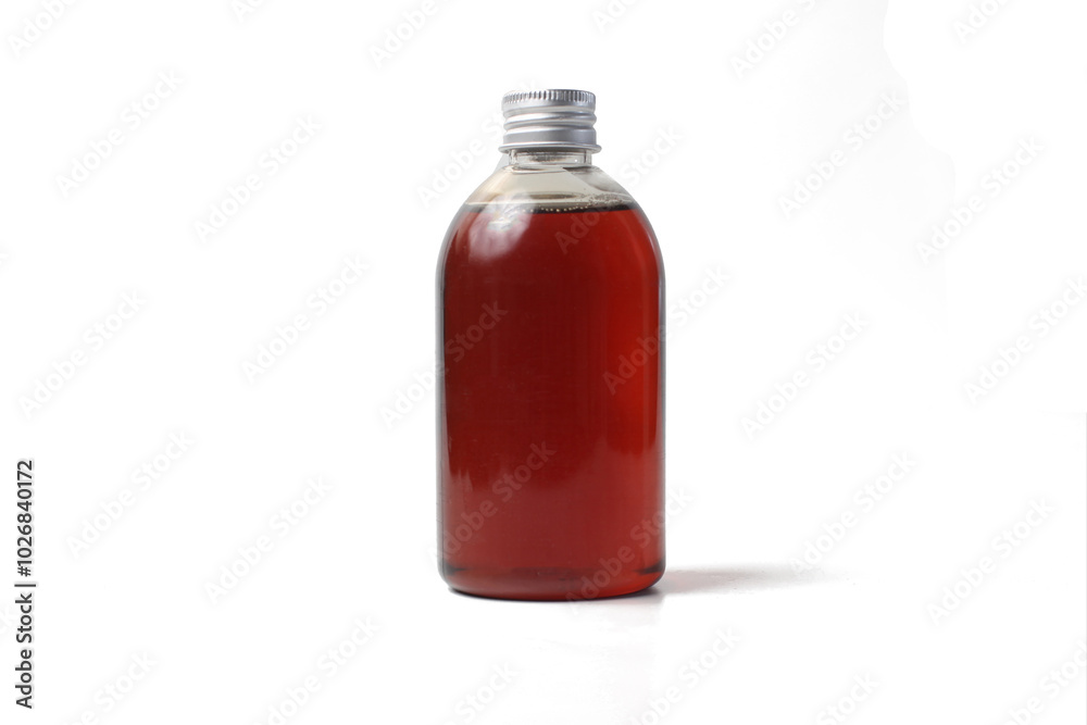 honey in a transparent plastic bottle, isolated on a white background honey in a transparent plastic bottle, isolated on a white background
