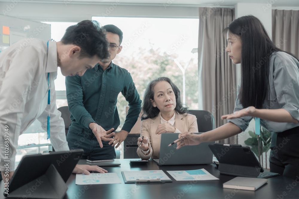 Group of business people discussing charts and graphs displaying business concepts, successful teamwork with investment and business growth showing teamwork results. Group of business people discussing charts and graphs displaying business concepts, successful teamwork with investment and business growth showing teamwork results.