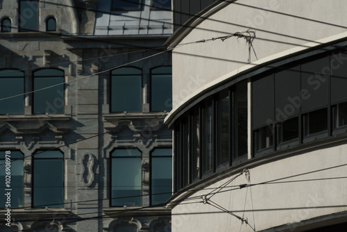 Stone and glass arcs  and therr reflection in dark office buildings in Gronland photo