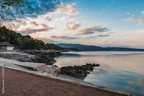 Fototapeta Naklejka Na Ścianę i Meble -  Krk Croatia 27..06.24Early morning on the beach in a quiet old town