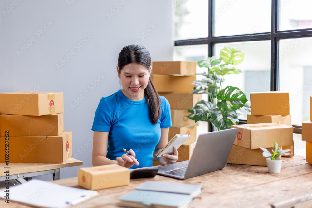 Asian woman entrepreneur using calculator for calculating financial expense at home, Prepare product for packaging process, Sme Online selling, Internet marketing, E-commerce concept.
Asian woman entrepreneur using calculator for calculating financial expense at home, Prepare product for packaging process, Sme Online selling, Internet marketing, E-commerce concept.