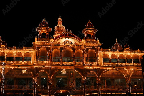 Mysore Palace Illuminated with Lights at Night photo