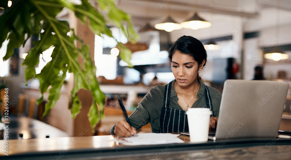 Cafe owner, laptop or writing on documents for coffee shop planning, financial tracking or profit accounting. Thinking, paperwork or technology for small business woman in restaurant for bakery sales Cafe owner, laptop or writing on documents for coffee shop planning, financial tracking or profit accounting. Thinking, paperwork or technology for small business woman in restaurant for bakery sales