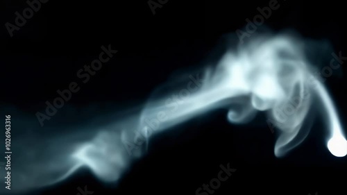 Smoke effect on black background, Ethereal smoke, ghostly wisps, flowing tendrils, dark background, mysterious atmosphere, abstract form, luminous vapor, surreal photography, ethereal light