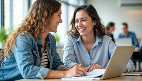 Young Professionals Collaborating and Smiling in a Modern Office Setting