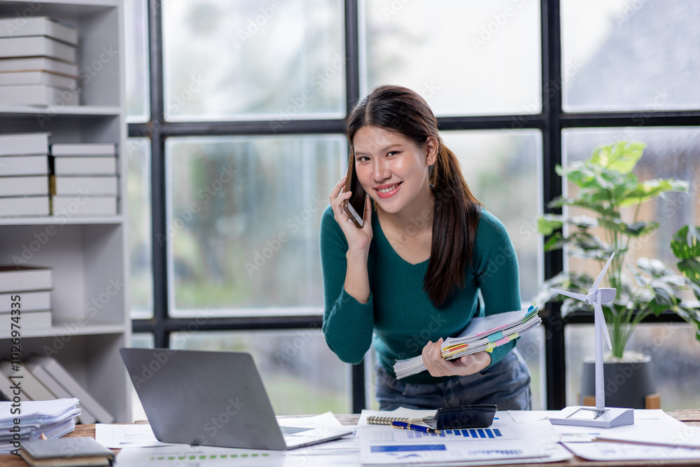 Business woman manager or company worker call phone accounting documents laptop, checking financial data or marketing Accountant report working in the office.
Business woman manager or company worker call phone accounting documents laptop, checking financial data or marketing Accountant report working in the office.