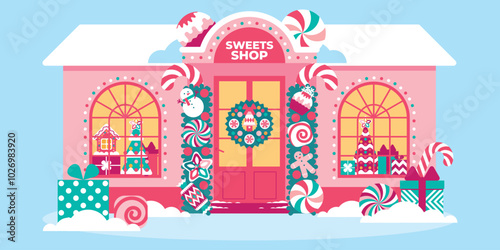 Beautiful sweet shop in Christmas festive decor with garlands, lights, creative decorations. Showcase of confectionery shop with Christmas sweet souvenirs. Xmas house exterior decoration