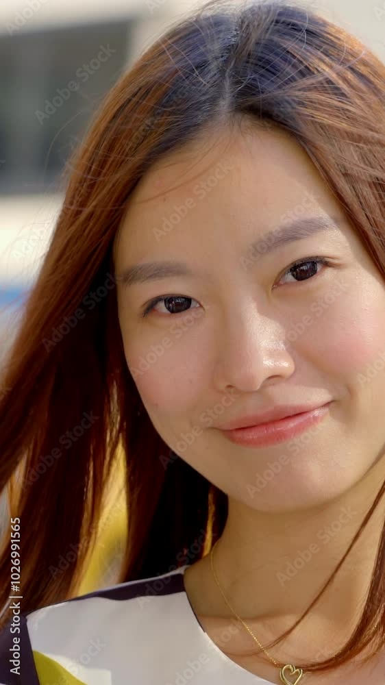 A Smiling Young Woman Posed Gracefully in Beautiful Natural Light While Outdoors Enjoying the Day A Smiling Young Woman Posed Gracefully in Beautiful Natural Light While Outdoors Enjoying the Day