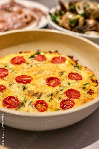 Freshly baked frittata with cherry tomatoes