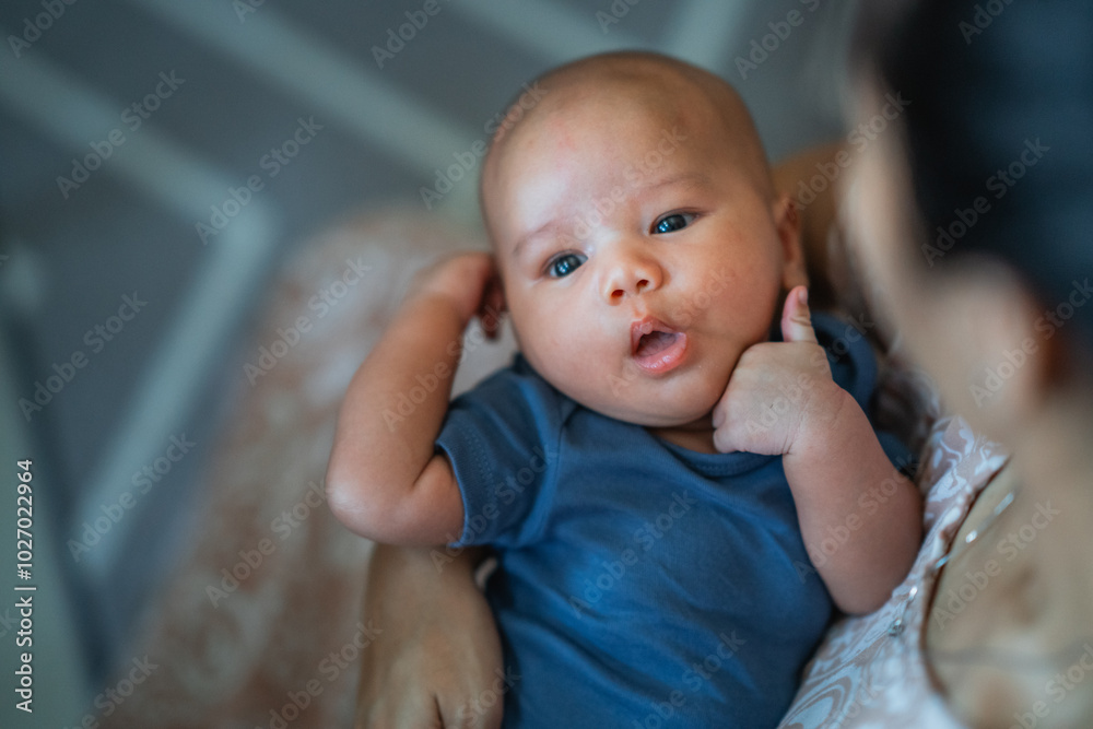 The cute baby shows genuine curiosity in a warm, cozy, and inviting environment The cute baby shows genuine curiosity in a warm, cozy, and inviting environment