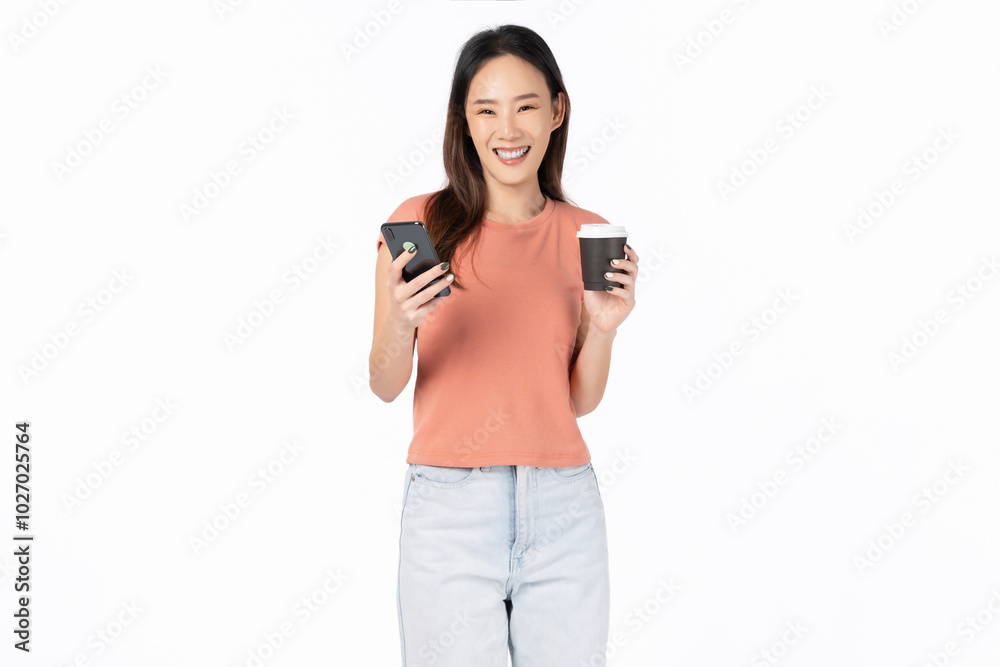 Young Asian woman holding smartphone and coffee cup isolated on white background.