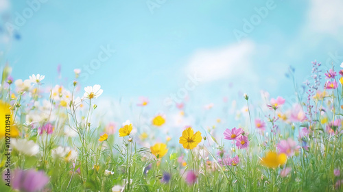 A serene field of wildflowers dancing in the breeze under a clear blue sky
