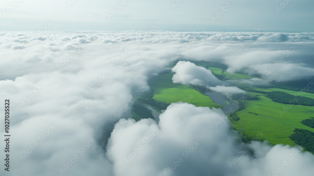 Obraz premium Flying through white clouds revealing green fields and rivers below
