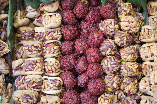 A Colorful Array of NutBased Snacks and Delicious Sweets for a Tasteful Experience photo