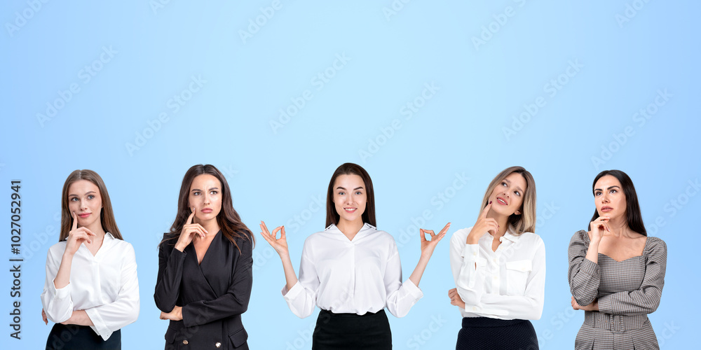 Smiling and pensive business people portraits in row, empty blue background Smiling and pensive business people portraits in row, empty blue background