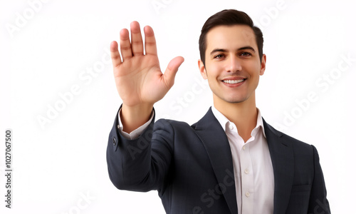 businessman dressed in a sharp tailored suit standing with one hand extended forward in a handshake gesture