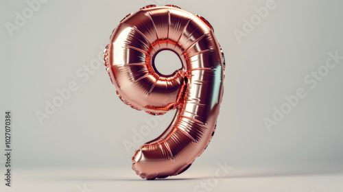 Elegant rose gold number 9 balloon isolated on a white background photo