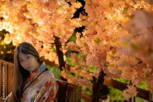 A Kimono-Clad Woman Sits Gracefully Beneath the Cherry Blossom Tree Bathed in Moonlight, Immersed in a Poetic Moment of Romance and Tranquility