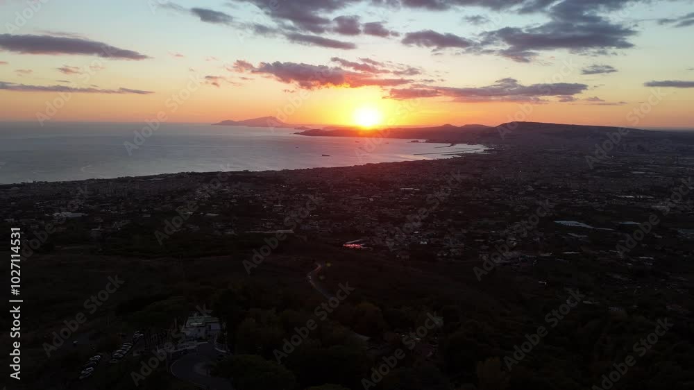 A breathtaking aerial view of Ercolano,with the city nestled between the sea and the mountains.Drone captures the stunning coastal panorama,showcasing the ancient ruins and the shimmering waters below A breathtaking aerial view of Ercolano,with the city nestled between the sea and the mountains.Drone captures the stunning coastal panorama,showcasing the ancient ruins and the shimmering waters below