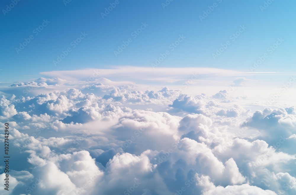 Tranquil Sky with Fluffy Clouds at High Altitude Tranquil Sky with Fluffy Clouds at High Altitude