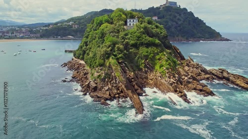 Santa Clara island on background of Monte Igualdo mountain in San Sebastian, Spain photo