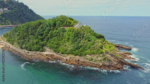 Santa Clara island on background of Monte Igualdo mountain in San Sebastian, Spain photo