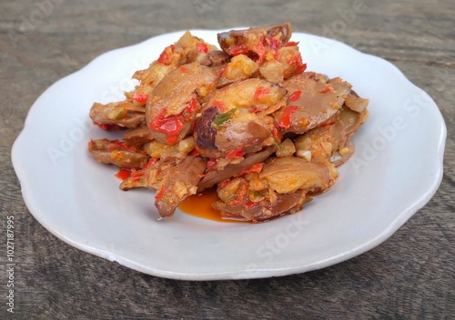 Jengkol balado is a traditional indonesian food. Made from jengkol seeds or dogfruit cooked with balado or spicy chili sauce. Other name is sambal jengkol. photo