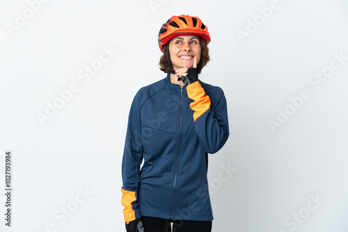 Young English cyclist woman isolated on white background thinking an idea while looking up