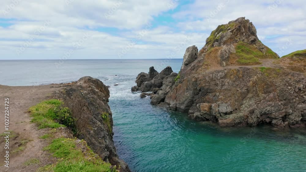 Rocky coastline cove and headland trail at Te Arai beach, Auckland, New Zealand. Rocky coastline cove and headland trail at Te Arai beach, Auckland, New Zealand.