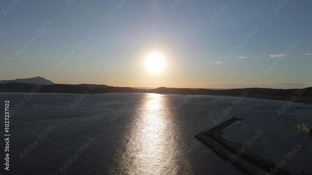 A stunning aerial shot of Pozzuoli, highlighting its scenic coastline and vibrant harbor.The drone captures the ancient Roman ruins, the calm sea, and the natural beauty surrounding the historic city.