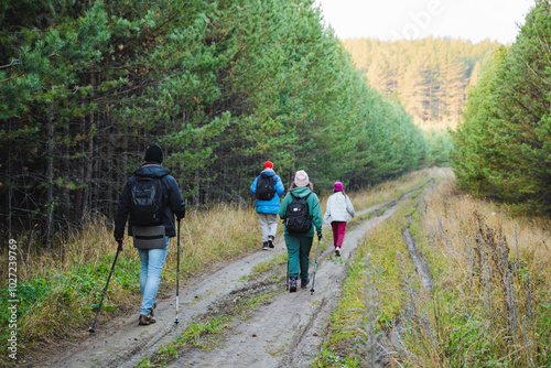 Were currently enjoying a delightful and memorable family hike along a serene trail, surrounded by beautiful trees and the peacefulness of nature