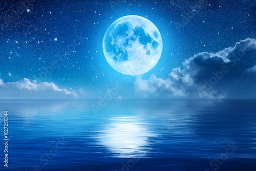 Night sky with super blue moon in the clouds over the calm blue sea