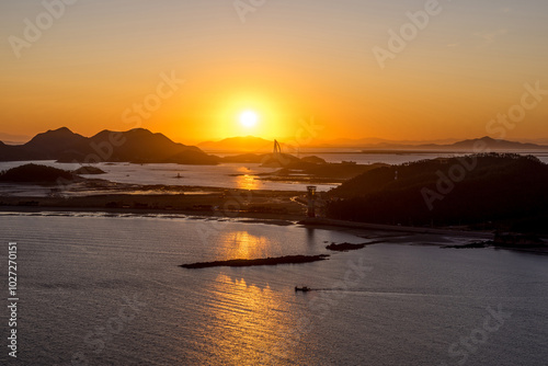 Sunrise above Seonyudo Island near Gunsan-si, Korea. It's located in the midwest of Korea.  photo