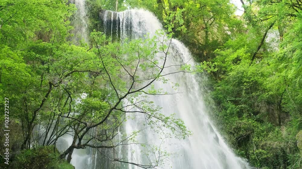 The Cascade d'Autoire waterfall in summer. A 30 meter high waterfall near Autoire in Lot Occitanie Southern France The Cascade d'Autoire waterfall in summer. A 30 meter high waterfall near Autoire in Lot Occitanie Southern France