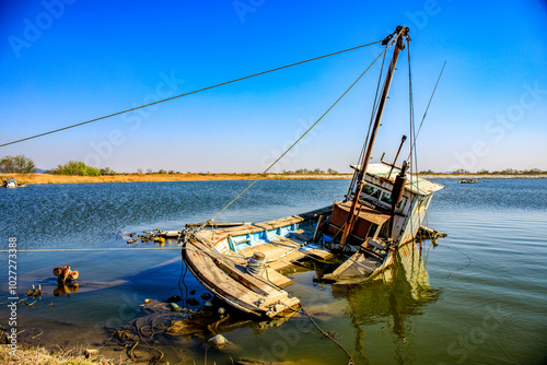 An abandoned fishing boat is submerged near Gunsan-si, Korea. photo