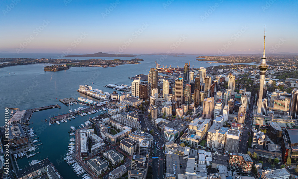 Aerial: Panoramic view of Auckland city skyline at sunset, New Zealand Aerial: Panoramic view of Auckland city skyline at sunset, New Zealand