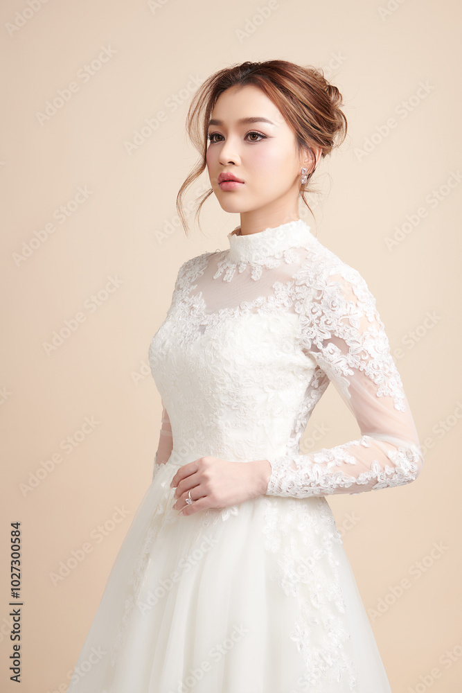 Beautiful young asian woman in wedding dress on beige background, Beautiful young asian woman in wedding dress on beige background,